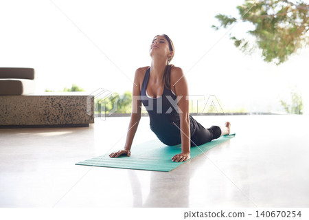 Stretching, summer and woman with wellness, yoga and fitness with exercise and balance. Person, yogi and girl on the floor with training and workout with sunshine and breathing with health and home Stretching, summer and woman with wellness, yoga and fitness with exercise and balance. Person, yogi and girl on the floor with training and workout with sunshine and breathing with health and home 140670254
