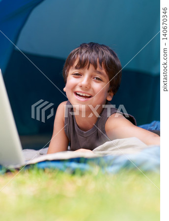Boy, happy child in portrait and camping, relax in tent and summer vacation with travel outdoor. Rest on sleeping bag, young kid with smile and adventure in nature, childhood and recreation for fun Boy, happy child in portrait and camping, relax in tent and summer vacation with travel outdoor. Rest on sleeping bag, young kid with smile and adventure in nature, childhood and recreation for fun 140670346