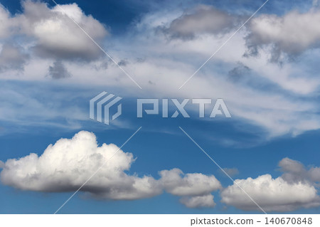 Layered White Clouds Against Blue Summer Sky Layered White Clouds Against Blue Summer Sky 140670848