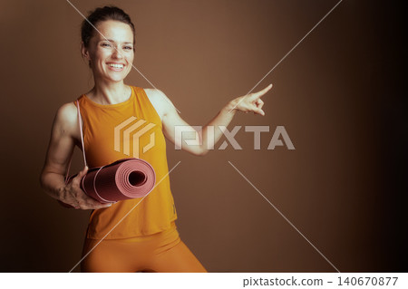 Smiling Woman Directing, Ready for Yoga Smiling Woman Directing, Ready for Yoga 140670877