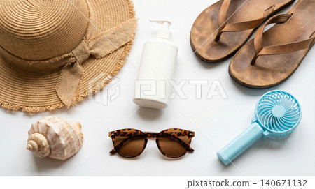 Summer beach vacation accessories including hat sunglasses and sunscreen with sunglasses sunscreen seashells vacation protection accessories tropical lifestyle equipment isolated background Summer beach vacation accessories including hat sunglasses and sunscreen with sunglasses sunscreen seashells vacation protection accessories tropical lifestyle equipment isolated background 140671132