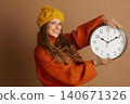 Presenting Time: Cheerful Woman in Fall Fashion 140671326