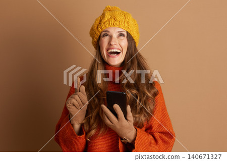 Cheerful Woman with a Bright Idea and Smartphone Cheerful Woman with a Bright Idea and Smartphone 140671327