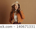 Joyful Woman in Autumn Suede Jacket and Fedora 140671331