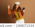Engaged Woman with Smartphone and Pursed Lips 140671334