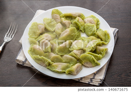 plate of Boiled Green Vegetable Dumplings, Traditional Chinese Jiaozi 140671675