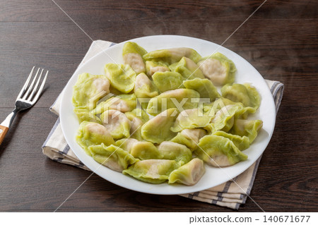 plate of Boiled Green Vegetable Dumplings, Traditional Chinese Jiaozi 140671677