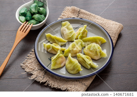 plate of Boiled Green Vegetable Dumplings, Traditional Chinese Jiaozi plate of Boiled Green Vegetable Dumplings, Traditional Chinese Jiaozi 140671681