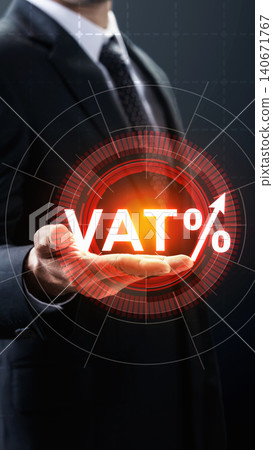 Close-up of a businessman showing a glowing virtual interface with a rising VAT percentage, symbolizing tax increases and economic changes Close-up of a businessman showing a glowing virtual interface with a rising VAT percentage, symbolizing tax increases and economic changes 140671767