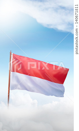 The Indonesian national flag, waving proudly on a pole above white clouds under a bright blue sunny sky. Perfect for Independence Day celebration concepts. Hari Kemerdekaan Dirgahayu Indonesia The Indonesian national flag, waving proudly on a pole above white clouds under a bright blue sunny sky. Perfect for Independence Day celebration concepts. Hari Kemerdekaan Dirgahayu Indonesia 140671811