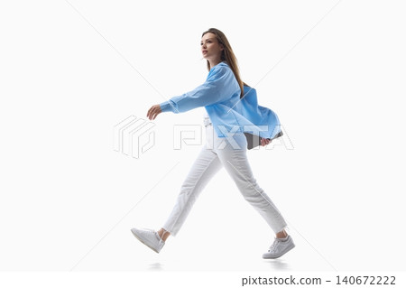 Confident woman walking forward with laptop on white background. Confident woman walking forward with laptop on white background. 140672222