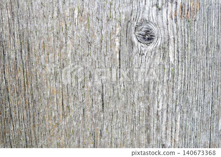 Texture of a weathered, old wooden board with a noticeable knot. Texture of a weathered, old wooden board with a noticeable knot. 140673368