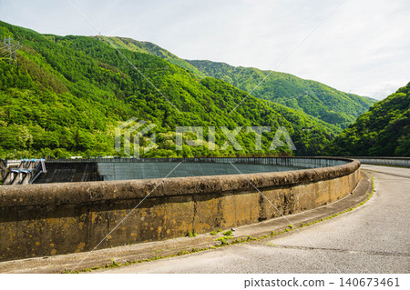 The lush greenery of the Suiden Dam and the mountain range of the Azusagawa Valley The lush greenery of the Suiden Dam and the mountain range of the Azusagawa Valley 140673461
