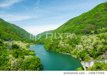 The beautiful surface of the Suidono Dam lake as it enters the season of fresh greenery. The beautiful surface of the Suidono Dam lake as it enters the season of fresh greenery. 140673488