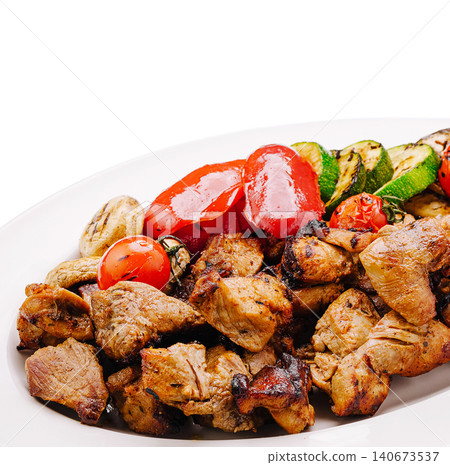 Grilled meat and vegetables on white plate Grilled meat and vegetables on white plate 140673537