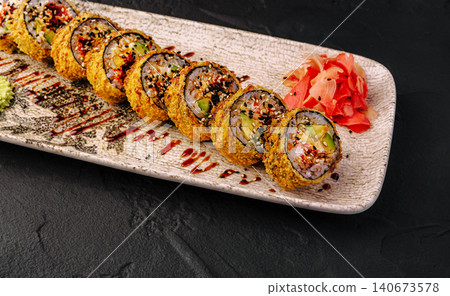 Tempura fried sushi rolls with unagi sauce and ginger Tempura fried sushi rolls with unagi sauce and ginger 140673578