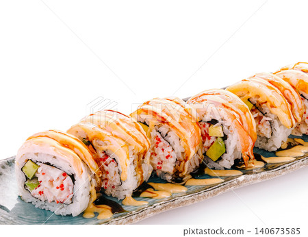 Sushi rolls with shrimp, crab, avocado, and sauce 140673585