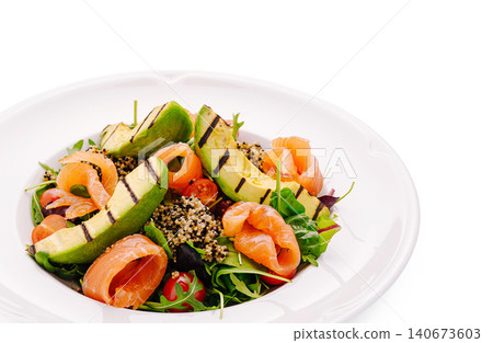 Healthy salmon salad with grilled avocado and quinoa Healthy salmon salad with grilled avocado and quinoa 140673603