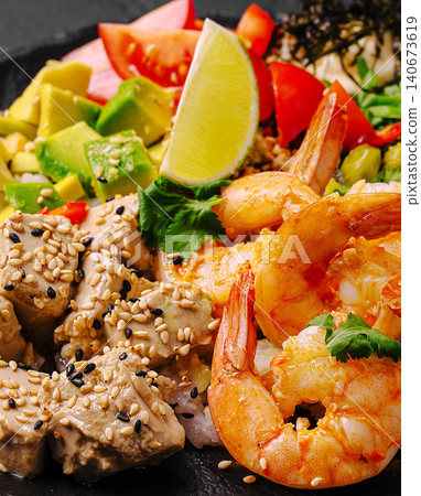 Healthy poke bowl with shrimp, tofu, and fresh vegetables Healthy poke bowl with shrimp, tofu, and fresh vegetables 140673619