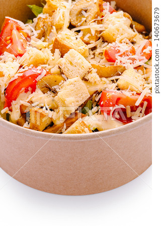 Caesar salad with croutons, cheese, and chicken in takeaway bowl Caesar salad with croutons, cheese, and chicken in takeaway bowl 140673679