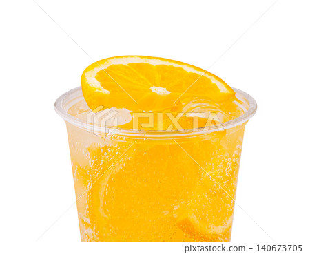 Orange slice garnishing refreshing bubbly drink in cup 140673705