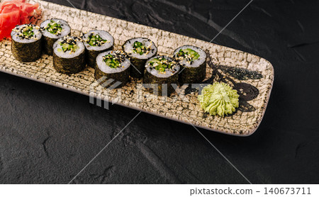 Cucumber kappa maki sushi rolls with wasabi and ginger 140673711
