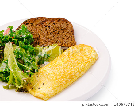 Omelet breakfast with fresh salad and rye bread Omelet breakfast with fresh salad and rye bread 140673715