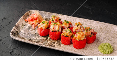 Red tobiko uramaki sushi serving fresh salmon tuna Red tobiko uramaki sushi serving fresh salmon tuna 140673732