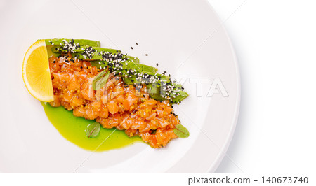 Salmon tartare with avocado lemon and sesame Salmon tartare with avocado lemon and sesame 140673740