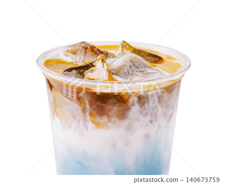 Layered iced butterfly pea latte espresso drink Layered iced butterfly pea latte espresso drink 140673759