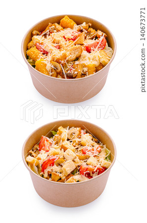Caesar salad in paper bowls for takeout food delivery Caesar salad in paper bowls for takeout food delivery 140673771