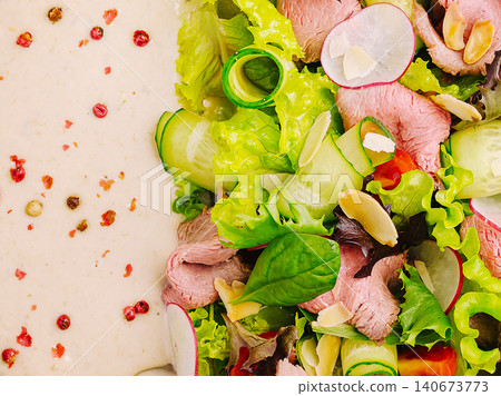Fresh roast beef salad with creamy dressing and peppercorn Fresh roast beef salad with creamy dressing and peppercorn 140673773