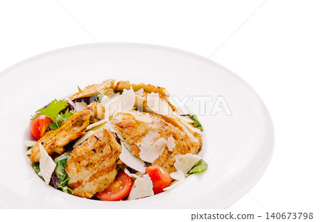 Caesar salad with grilled chicken and parmesan flakes 140673798