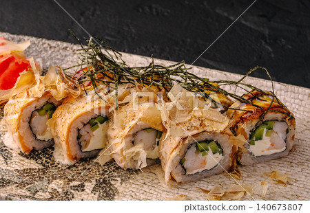 Sushi rolls with salmon, shrimp, bonito flakes, and nori Sushi rolls with salmon, shrimp, bonito flakes, and nori 140673807