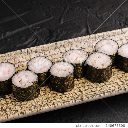 Sushi maki rolls with shrimp and rice on plate 140673808