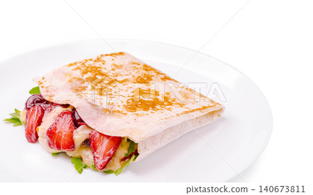 Strawberry crepe dessert on white plate 140673811