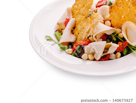 Chicken salad with sun-dried tomatoes, arugula, and parmesan crisps Chicken salad with sun-dried tomatoes, arugula, and parmesan crisps 140673927