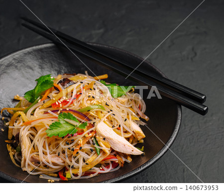 Glass noodle stir-fry with chicken and vegetables Glass noodle stir-fry with chicken and vegetables 140673953