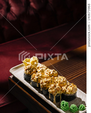 Baked sushi rolls with creamy sauce and ginger Baked sushi rolls with creamy sauce and ginger 140673968
