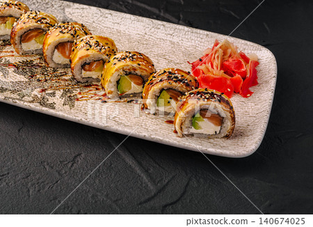 Sushi rolls with eel, salmon, avocado, cream cheese, and sesame seeds Sushi rolls with eel, salmon, avocado, cream cheese, and sesame seeds 140674025