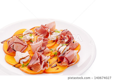 Persimmon carpaccio with prosciutto, burrata, balsamic glaze appetizer 140674027