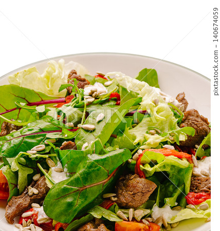 Fresh green salad with beef and sunflower seeds 140674059