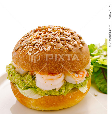 Shrimp and avocado burger with lettuce and seeds 140674060
