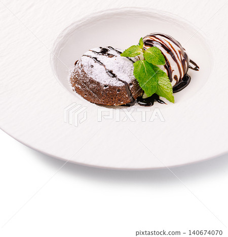 Chocolate lava cake serving with ice cream and mint Chocolate lava cake serving with ice cream and mint 140674070