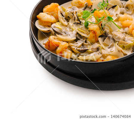 Seafood shrimp clams stew with cream sauce and herbs Seafood shrimp clams stew with cream sauce and herbs 140674084