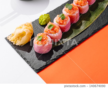 Sushi rolls with salmon toppings and pickled ginger Sushi rolls with salmon toppings and pickled ginger 140674090