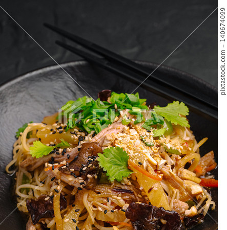 Asian noodles with duck, mushrooms, vegetables, and sesame seeds Asian noodles with duck, mushrooms, vegetables, and sesame seeds 140674099