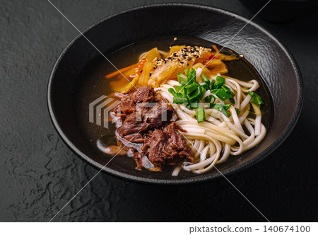 Korean beef udon noodle soup with kimchi Korean beef udon noodle soup with kimchi 140674100