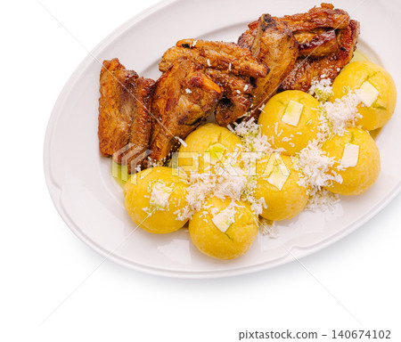 Roasted pork ribs with corn polenta balls 140674102