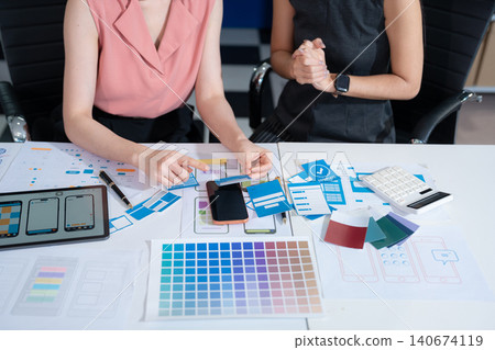 Two asian designer meeting concept design ideas at office. Two asian designer meeting concept design ideas at office. 140674119